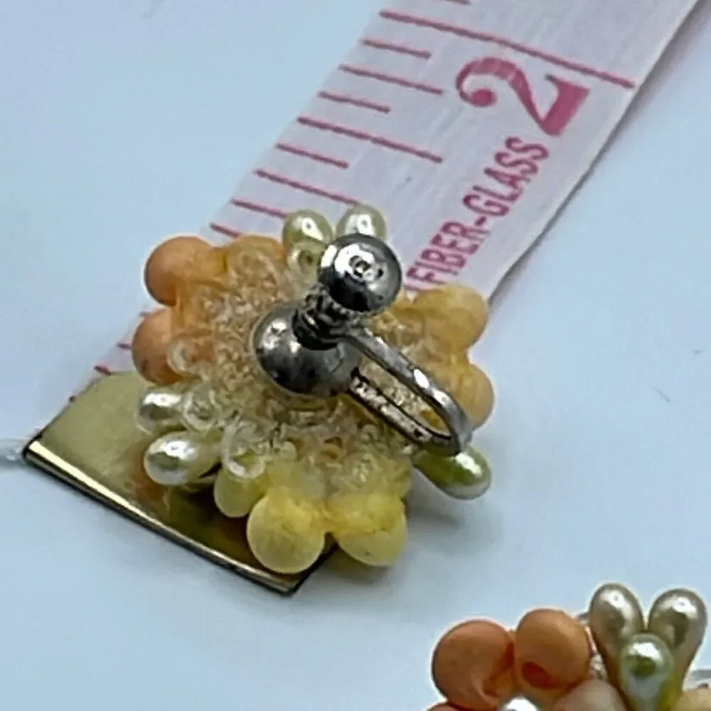 Vintage pastel shell handmade flowers with screw backs earrings.